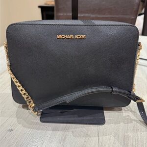 Michael Kors Elegant Black Crossbody Bag with Gold Accents
